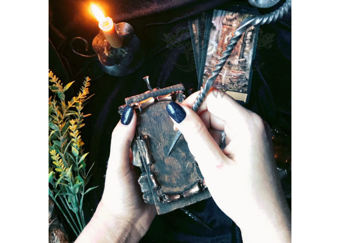 The candle The Scroll of Wishes with a forged awl to make your dreams come real