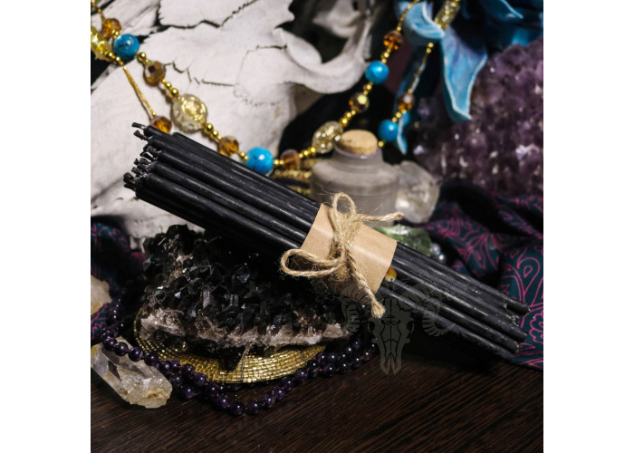 Thin black wax candles