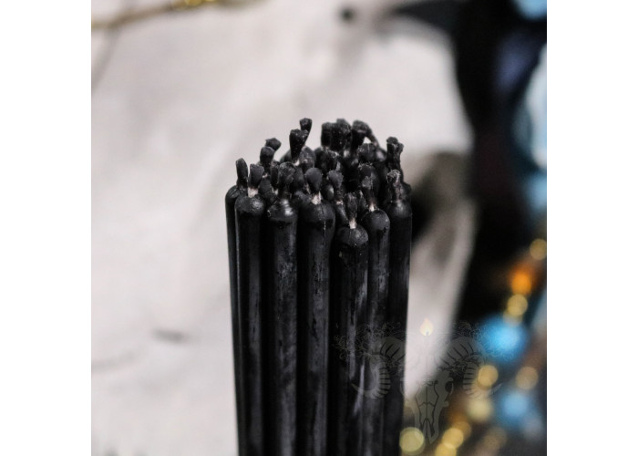 Thin black wax candles