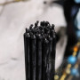 Thin black wax candles